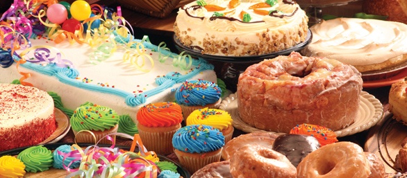 Photo of assorted cakes, donuts and cupcakes.