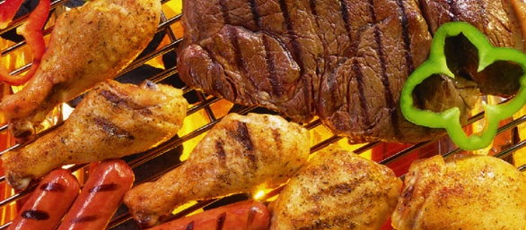 Variety of meat on a grill.